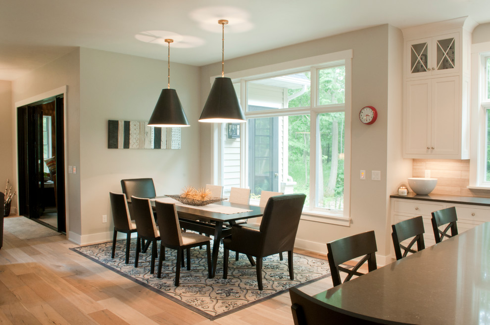 Kitchen/dining room combo - mid-sized transitional light wood floor and beige floor kitchen/dining room combo idea with beige walls and no fireplace