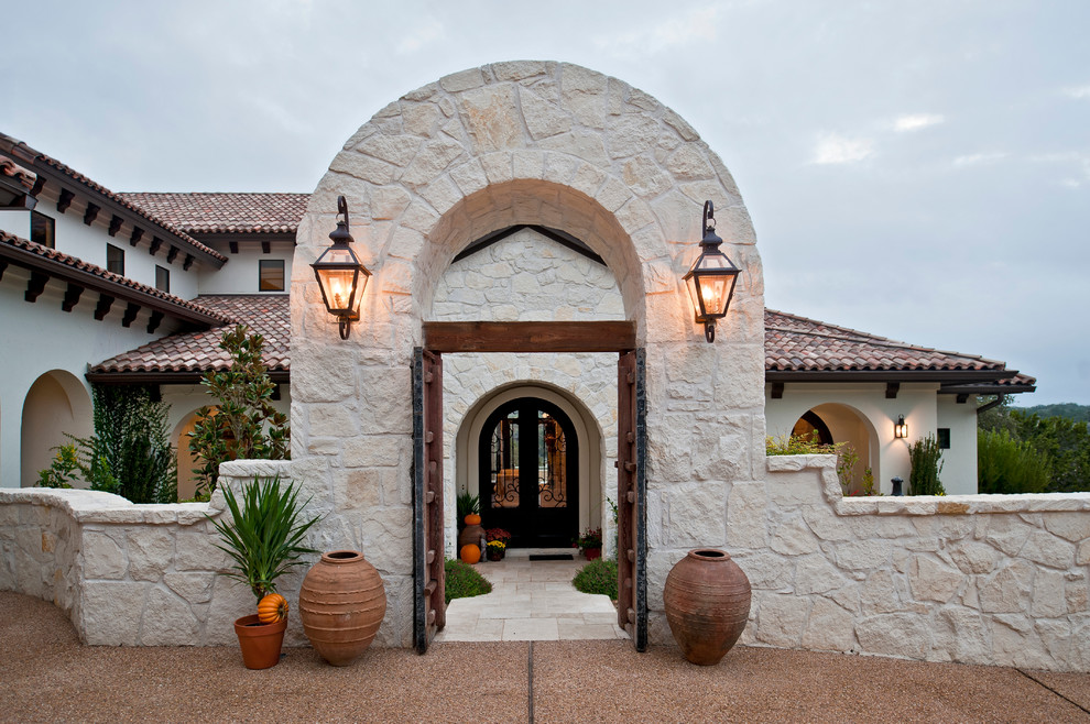 Inspiration for a mediterranean two-storey exterior in Austin.
