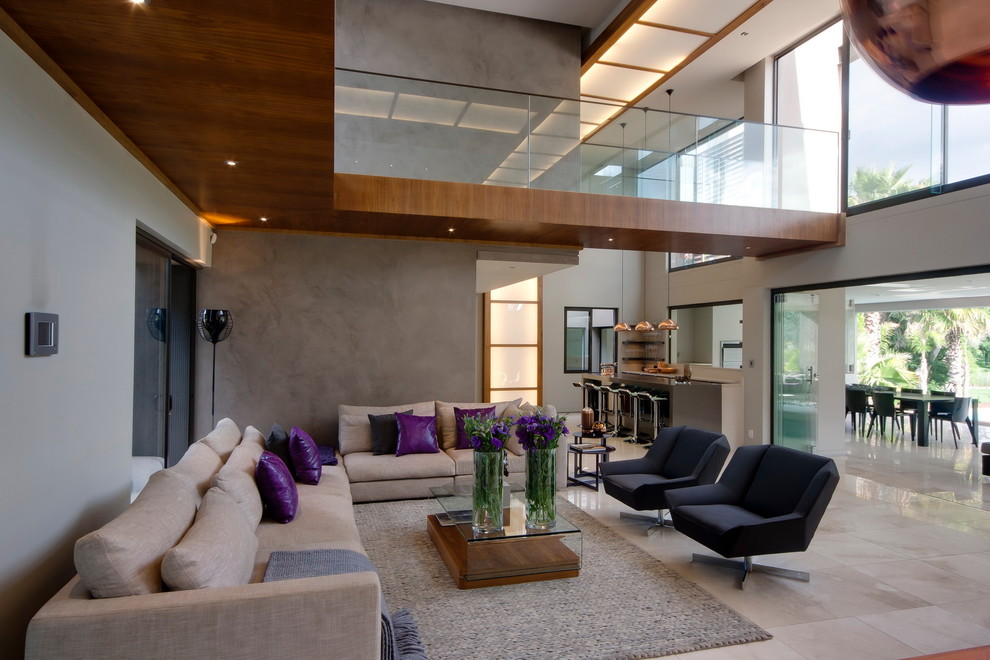 This is an example of a contemporary family room in Other with grey walls, no fireplace and no tv.