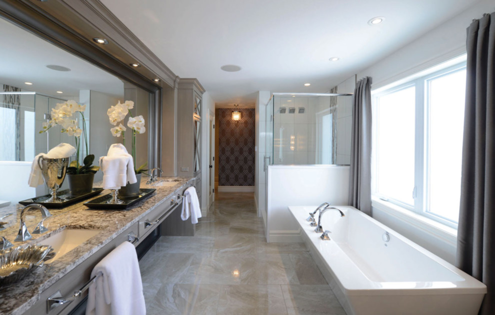 This is an example of a large transitional master bathroom in Toronto with beige cabinets, a freestanding tub, a corner shower, a two-piece toilet, white walls, an undermount sink, a hinged shower door and granite benchtops.