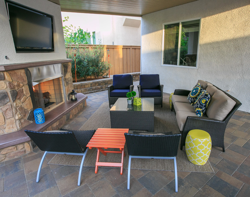 Mid-sized traditional backyard patio in San Diego with a fire feature.