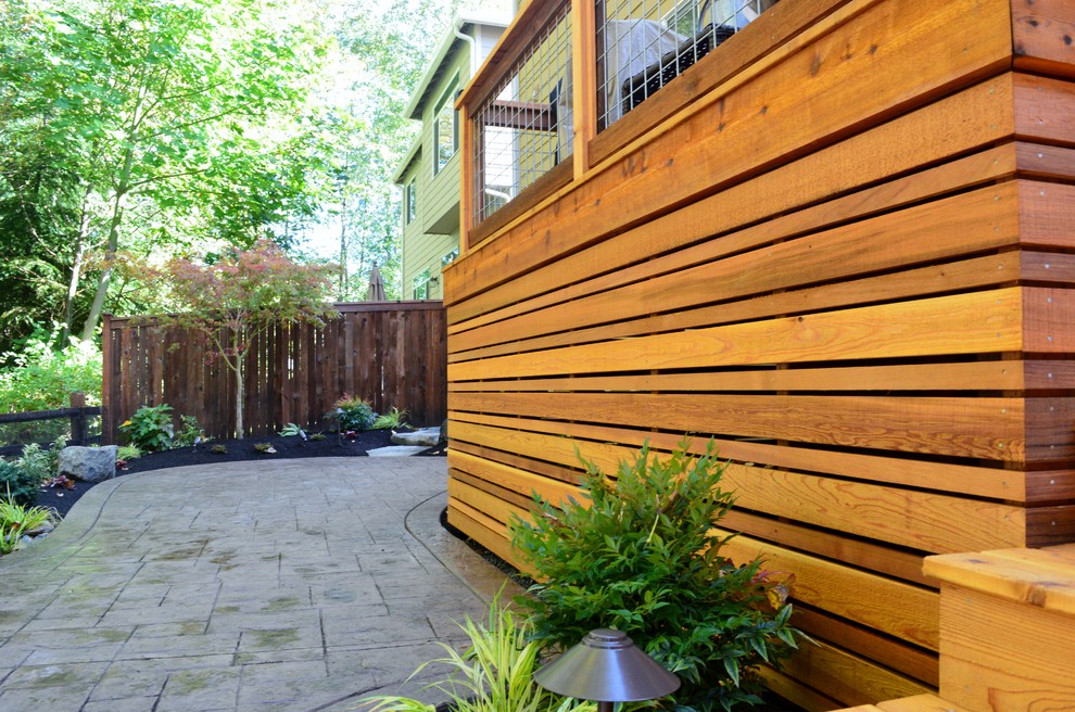 Mid-sized arts and crafts backyard deck photo in Seattle with no cover