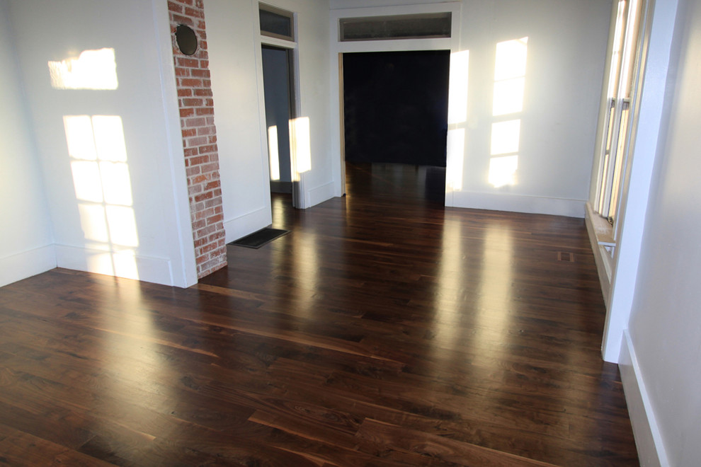 Inspiration for a 1950s dark wood floor dining room remodel in Boise with white walls