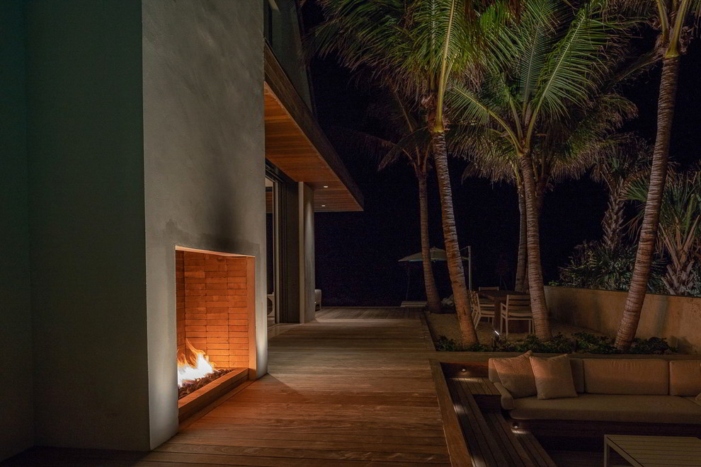 Design ideas for an expansive beach style backyard full sun garden in Miami with decking.