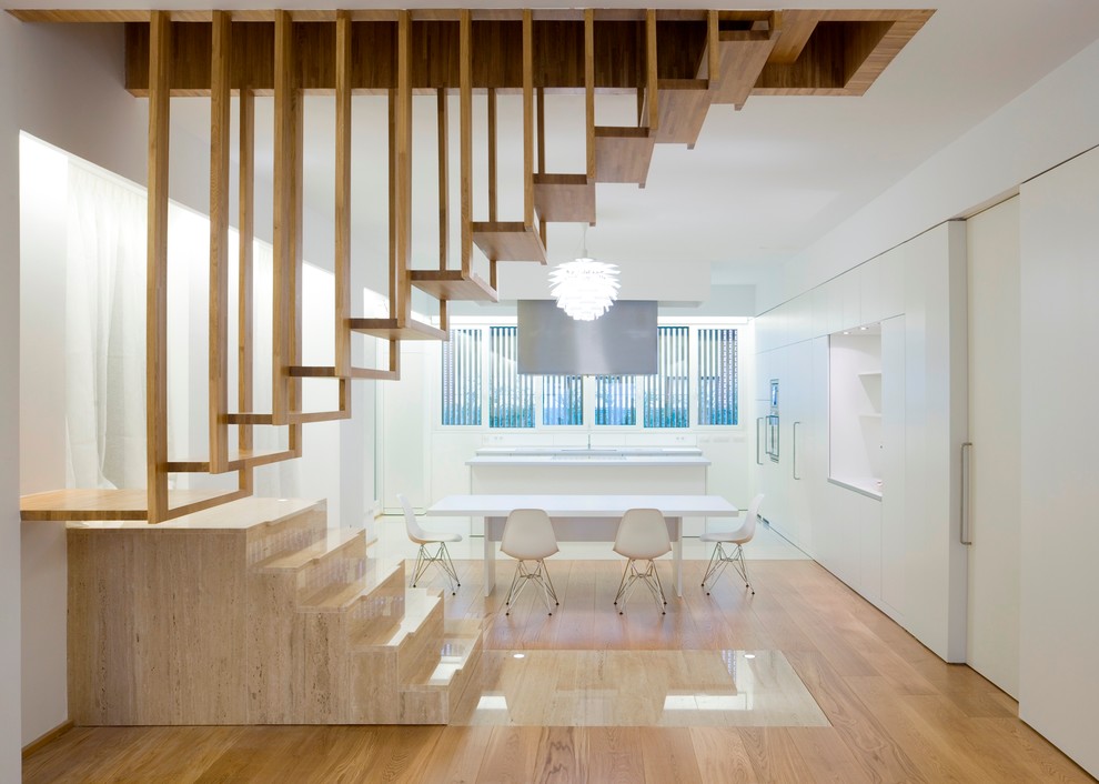 Inspiration for a mid-sized contemporary wood floating staircase in Amsterdam with open risers.