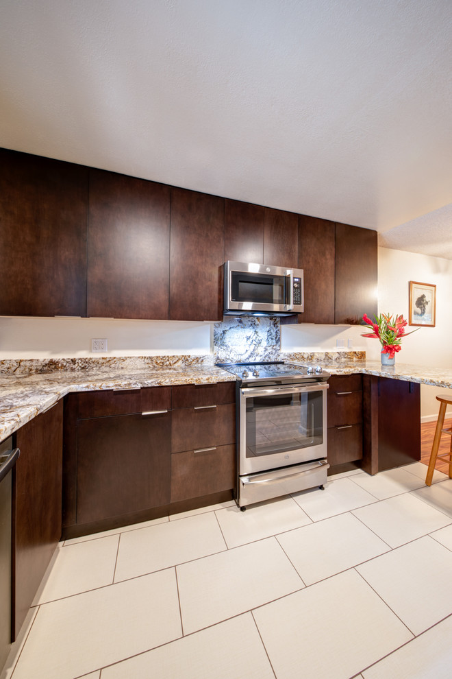 Photo of a small modern u-shaped separate kitchen in Hawaii with a single-bowl sink, flat-panel cabinets, dark wood cabinets, granite benchtops, stainless steel appliances, ceramic floors, no island, beige floor and yellow benchtop.