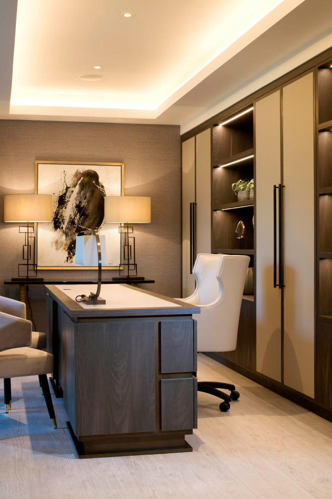 Photo of a mid-sized contemporary study room in Cheshire with brown walls, light hardwood floors, a freestanding desk, beige floor, coffered and wallpaper.