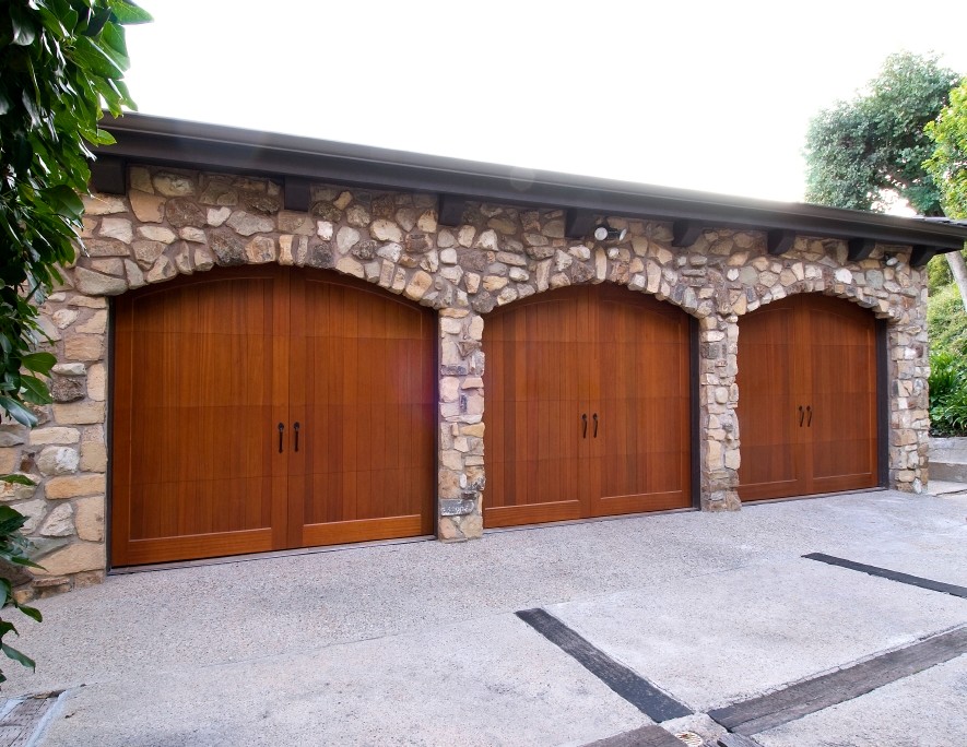 Photo of a large traditional four-car garage in Los Angeles.