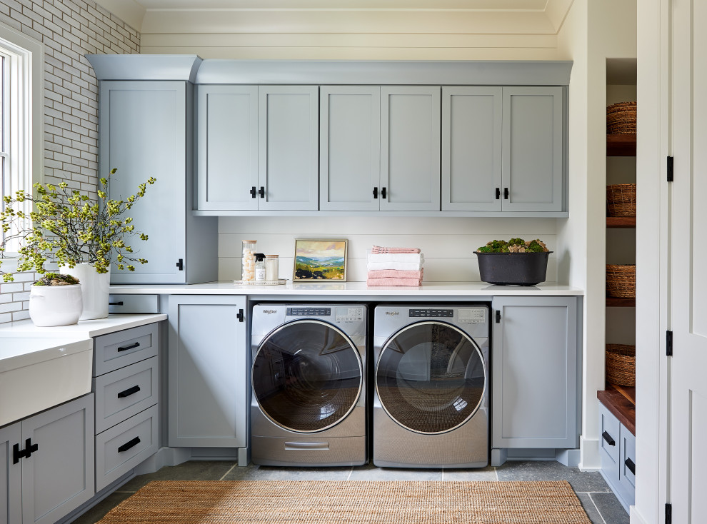 Example of a transitional laundry room design in Charlotte