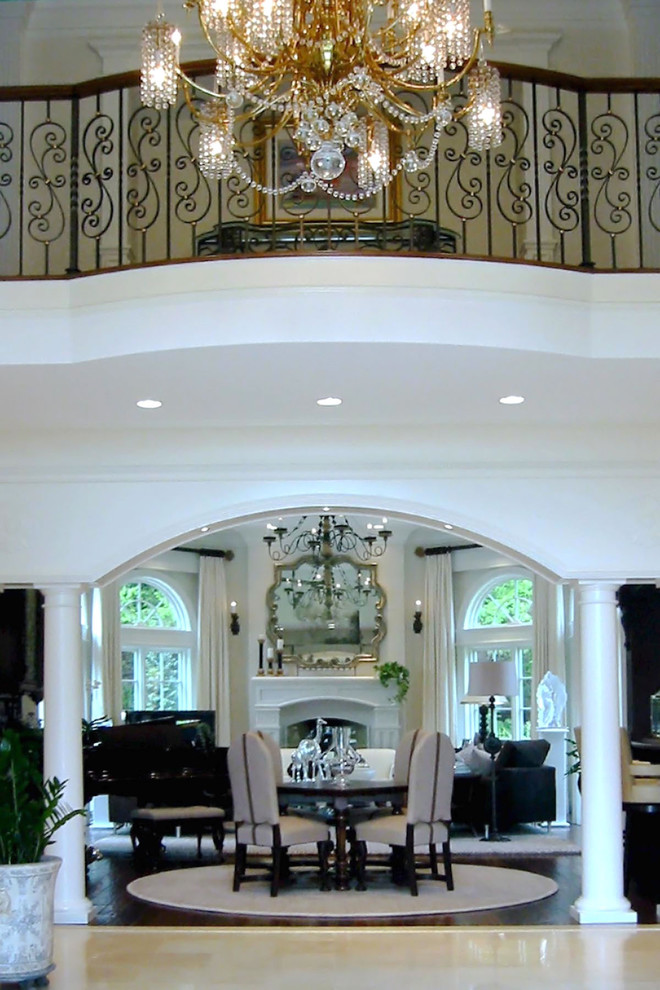 Large traditional foyer in Boston with white walls, limestone floors and beige floor.