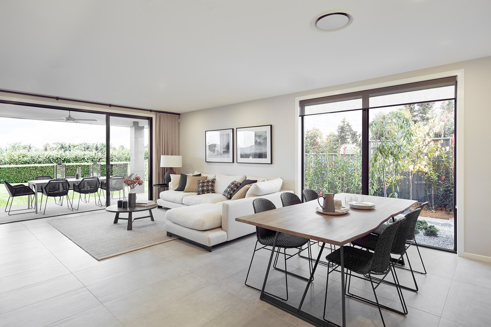 Photo of a mid-sized contemporary open concept living room in Canberra - Queanbeyan with beige walls, porcelain floors, no fireplace and grey floor.
