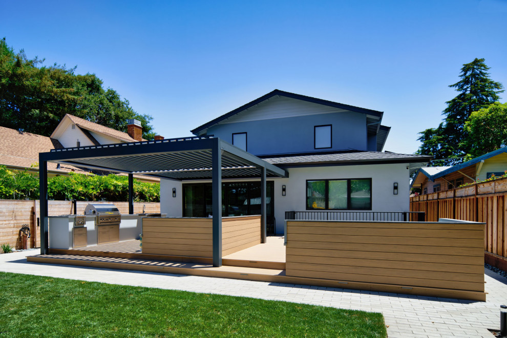 Mid-sized contemporary backyard and ground level deck in San Francisco with a pergola.