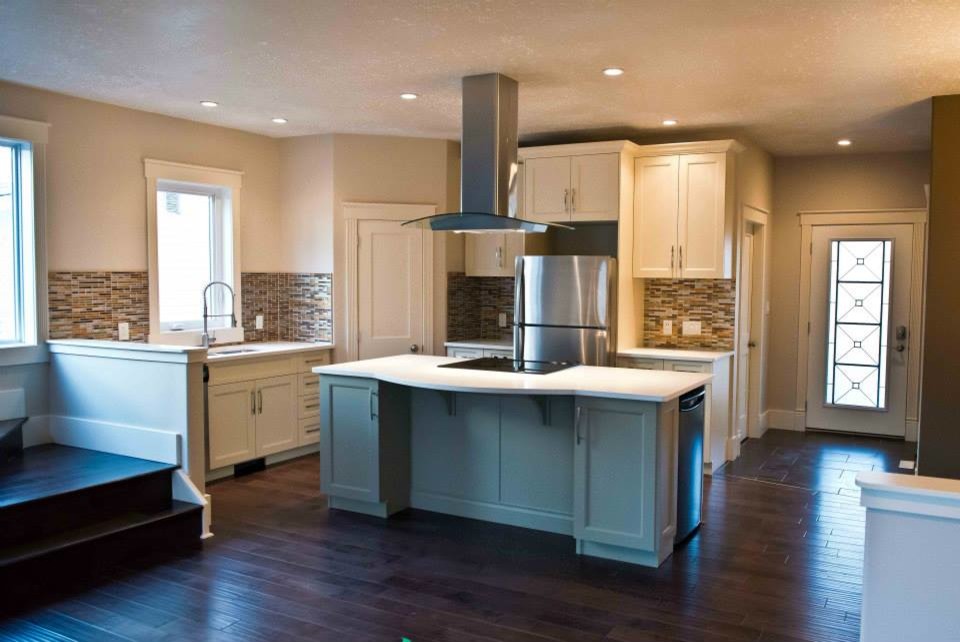Kitchen pantry - mid-sized transitional l-shaped dark wood floor kitchen pantry idea in Edmonton with an undermount sink, shaker cabinets, white cabinets, concrete countertops, multicolored backsplash, matchstick tile backsplash, stainless steel appliances and an island