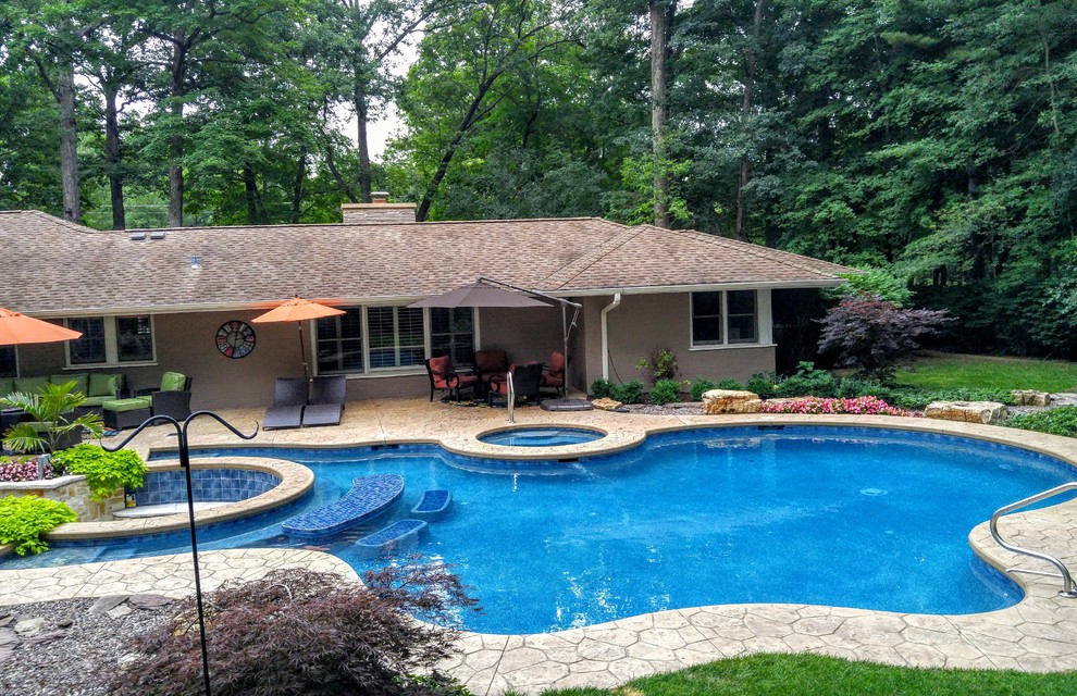 Pool and spa with a sunken fire pit.