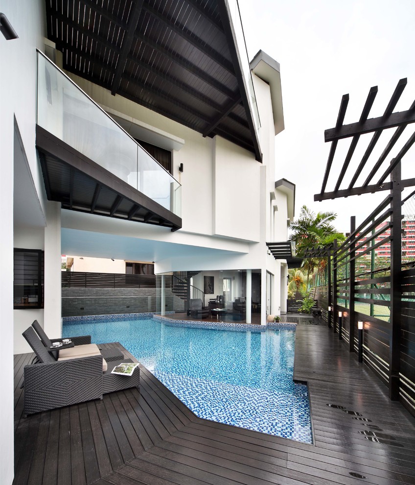 Photo of a contemporary pool in Singapore with decking.