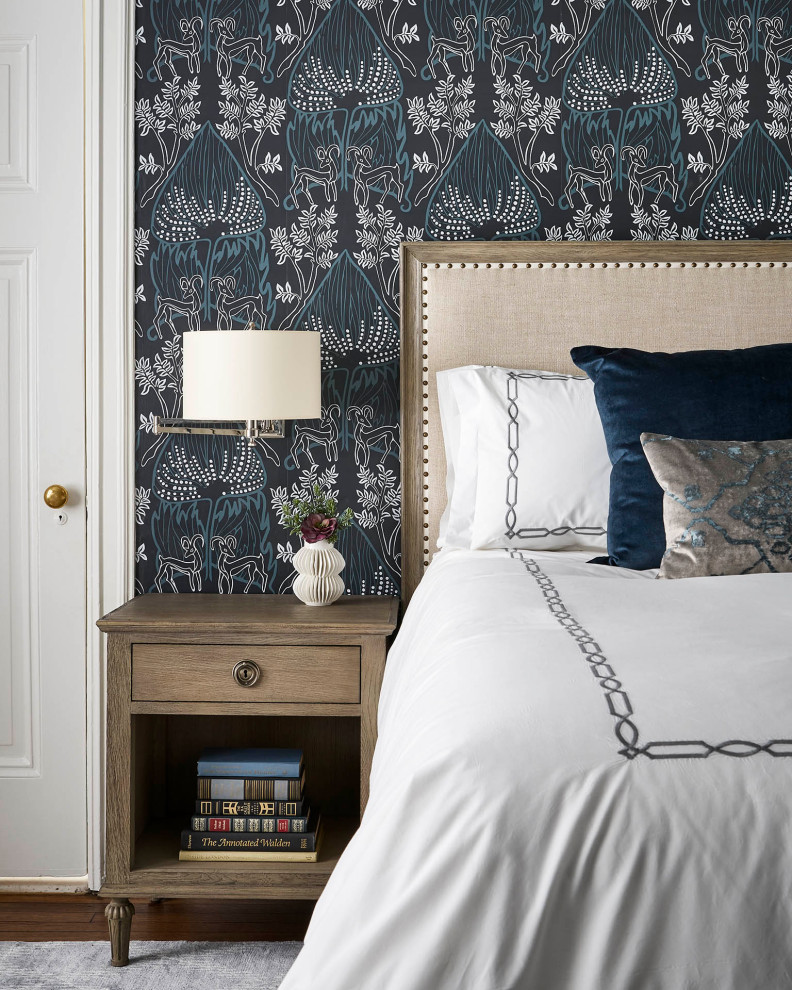 Inspiration for a mid-sized transitional master medium tone wood floor, brown floor and wallpaper bedroom remodel in Chicago with blue walls, a standard fireplace and a wood fireplace surround