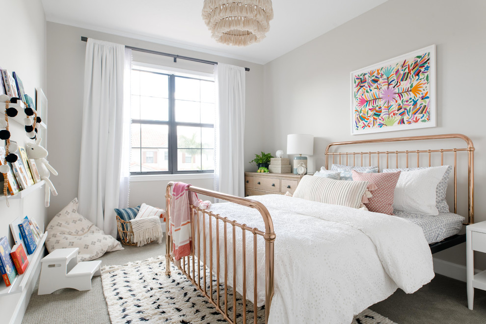 Photo of a beach style kids' room for girls in Miami with grey walls, carpet and grey floor.