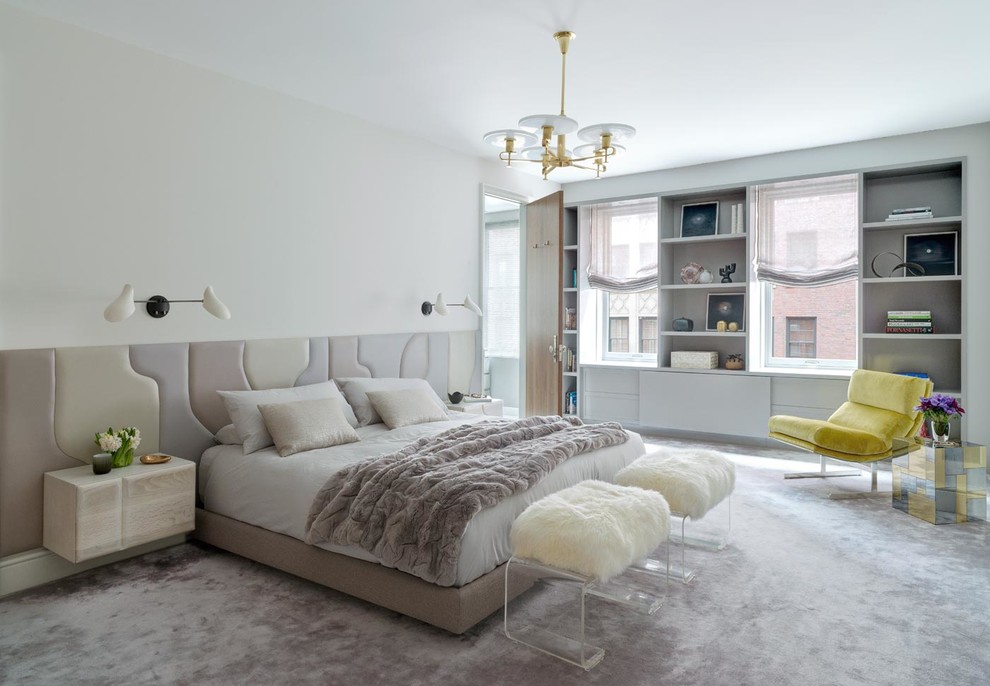 Photo of a contemporary bedroom in New York with white walls and carpet.