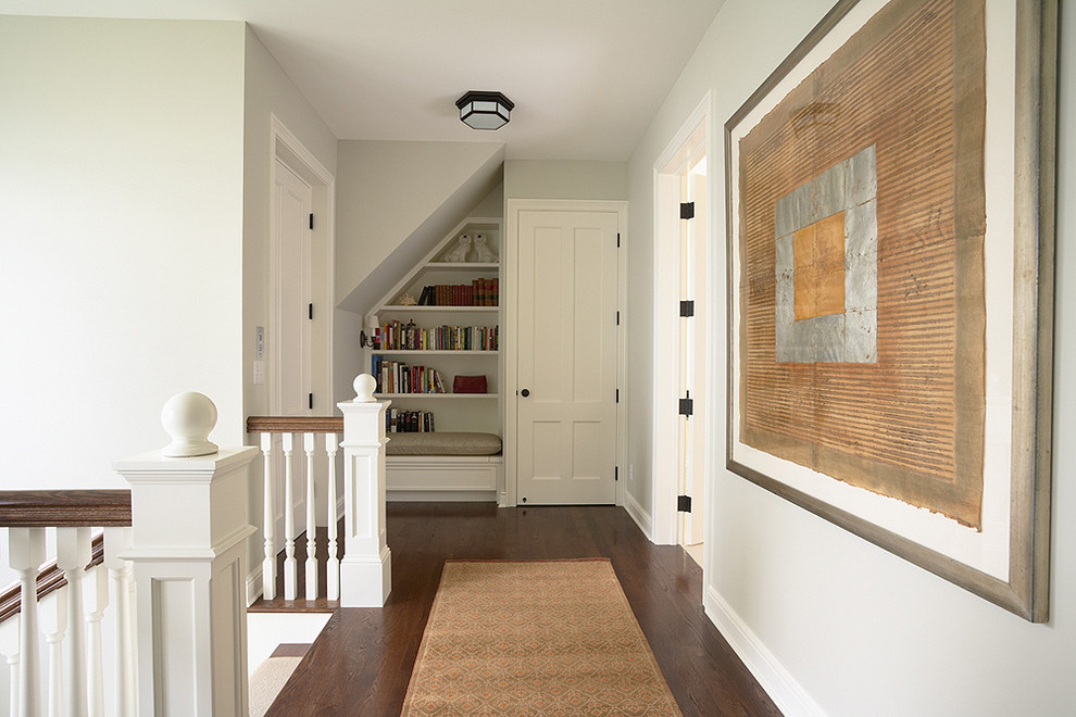 Design ideas for a traditional hallway in Minneapolis with white walls and dark hardwood floors.