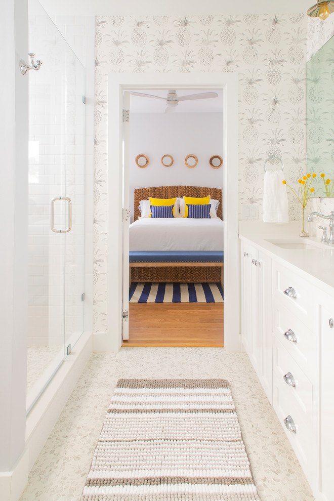 Inspiration for a large beach style kids bathroom in Miami with shaker cabinets, white cabinets, an open shower, a one-piece toilet, white tile, porcelain tile, white walls, mosaic tile floors, an undermount sink, quartzite benchtops, grey floor, a hinged shower door and white benchtops.