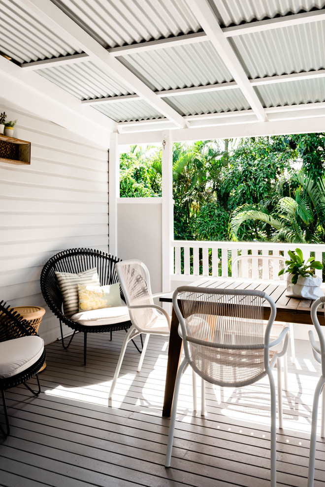 Mid-sized scandinavian backyard verandah in Brisbane with decking and an awning.