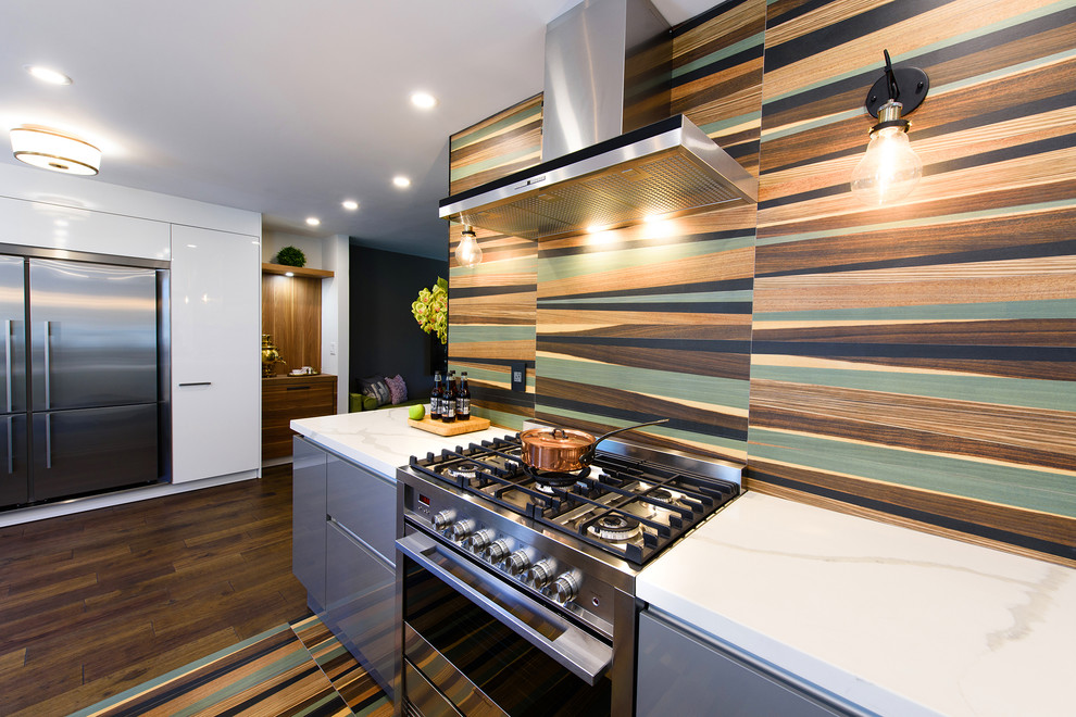 Inspiration for a small contemporary eat-in kitchen in Other with a drop-in sink, flat-panel cabinets, grey cabinets, multi-coloured splashback, stainless steel appliances, with island, brown floor and white benchtop.