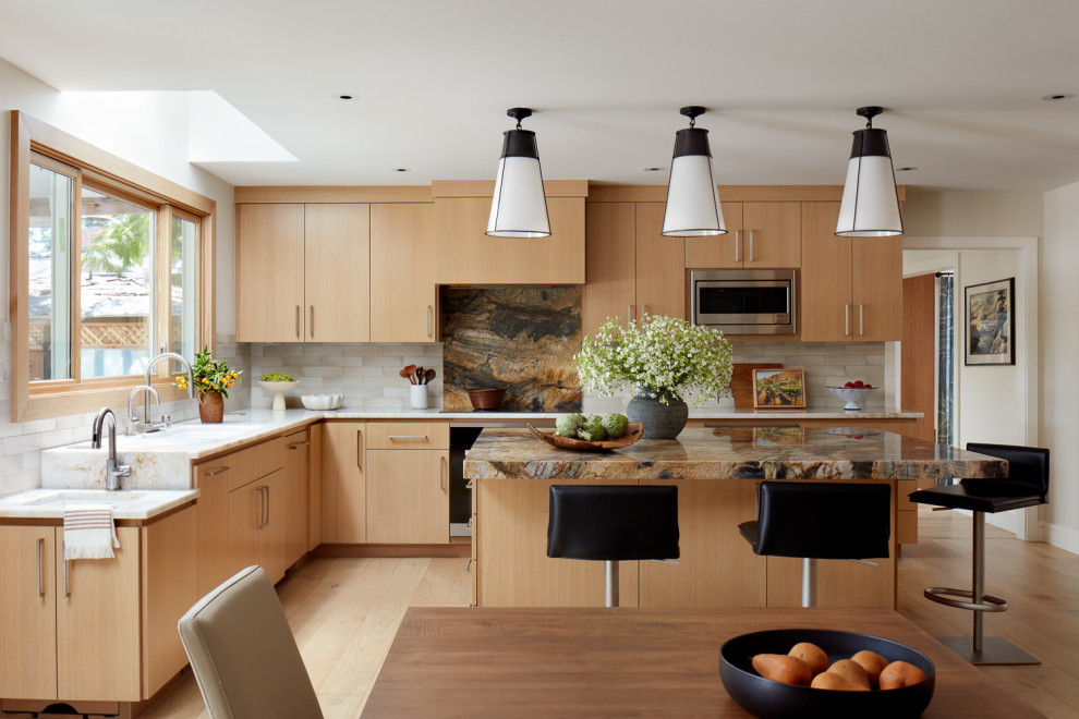 Design ideas for a large classic l-shaped kitchen in San Francisco with a submerged sink, flat-panel cabinets, medium wood cabinets, beige splashback, stainless steel appliances and an island.