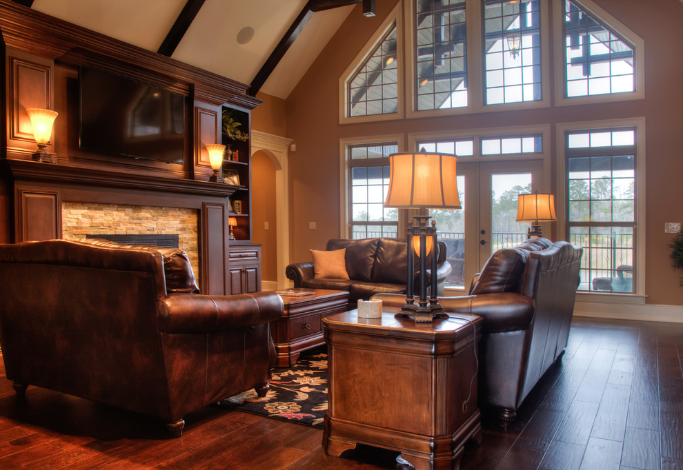 1950s open concept and formal dark wood floor living room photo in Other with a wall-mounted tv, brown walls, a standard fireplace and a stone fireplace