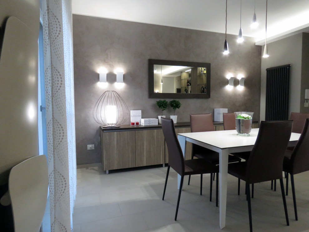 Design ideas for a mid-sized contemporary open plan dining in Catania-Palermo with multi-coloured walls, porcelain floors and beige floor.