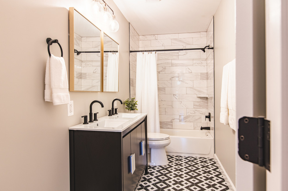 Photo of a medium sized contemporary family bathroom in DC Metro with flat-panel cabinets, dark wood cabinets, a built-in bath, black and white tiles, ceramic flooring, solid surface worktops, a shower curtain, white worktops, a single sink and a freestanding vanity unit.