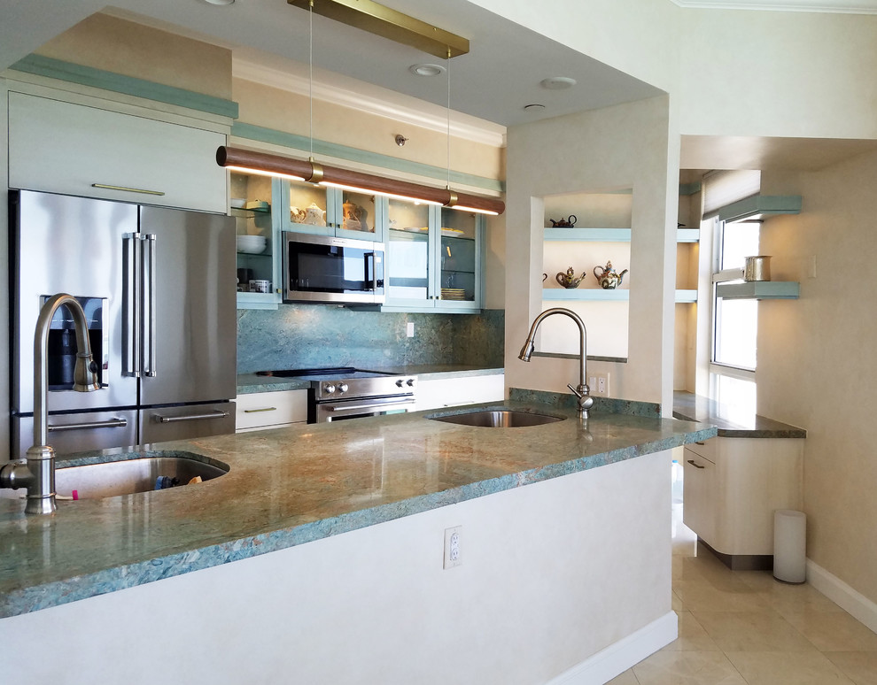 Design ideas for a mid-sized eclectic galley kitchen pantry in Miami with an undermount sink, glass-front cabinets, turquoise cabinets, granite benchtops, stainless steel appliances, marble floors, with island, beige floor and turquoise benchtop.