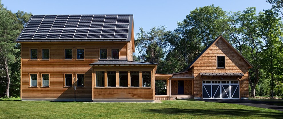 Mid-sized country brown two-story wood exterior home photo in Boston with a metal roof