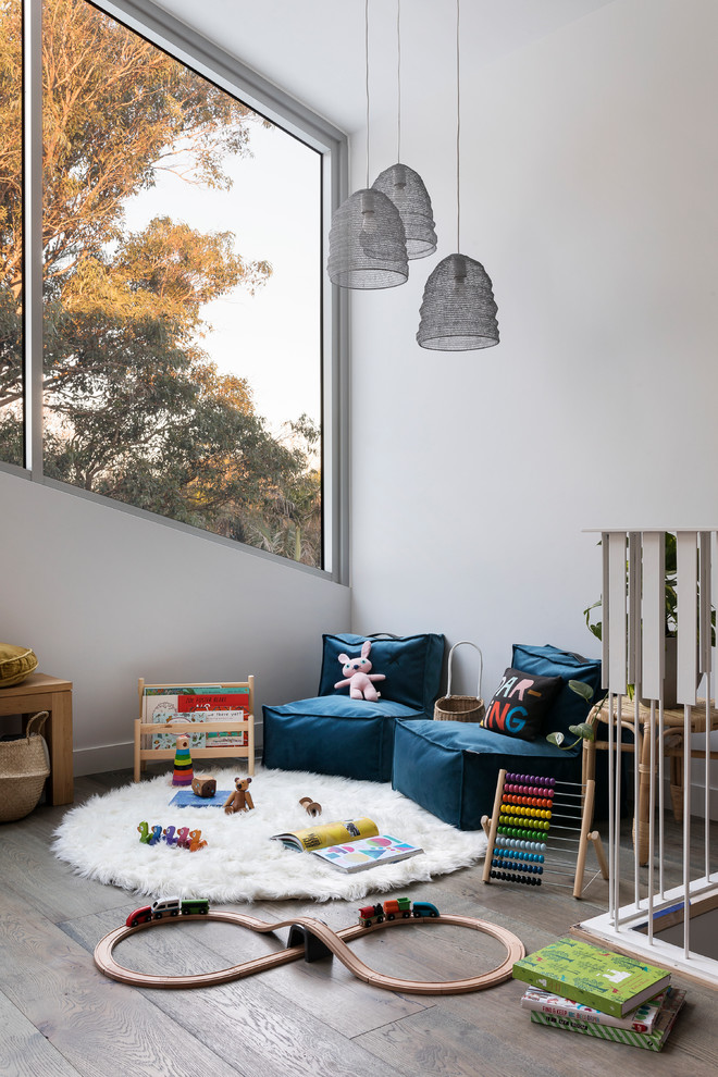 Small contemporary gender-neutral kids' playroom in Melbourne with medium hardwood floors.