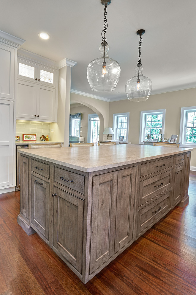 Inspiration for a large transitional galley eat-in kitchen in Chicago with an undermount sink, beaded inset cabinets, white cabinets, quartzite benchtops, blue splashback, ceramic splashback, stainless steel appliances, medium hardwood floors, with island, red floor and grey benchtop.
