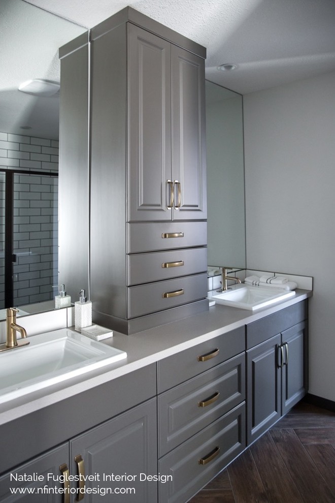 Small traditional master bathroom in Calgary with raised-panel cabinets, grey cabinets, an alcove shower, a two-piece toilet, white tile, ceramic tile, white walls, porcelain floors, a drop-in sink and laminate benchtops.