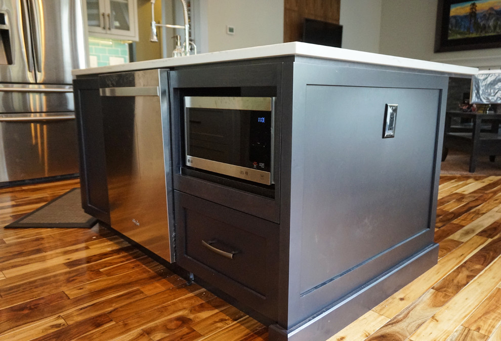 Kitchen - mid-sized transitional l-shaped medium tone wood floor and brown floor kitchen idea in Calgary with an undermount sink, shaker cabinets, gray cabinets, quartz countertops, blue backsplash, ceramic backsplash, stainless steel appliances and an island