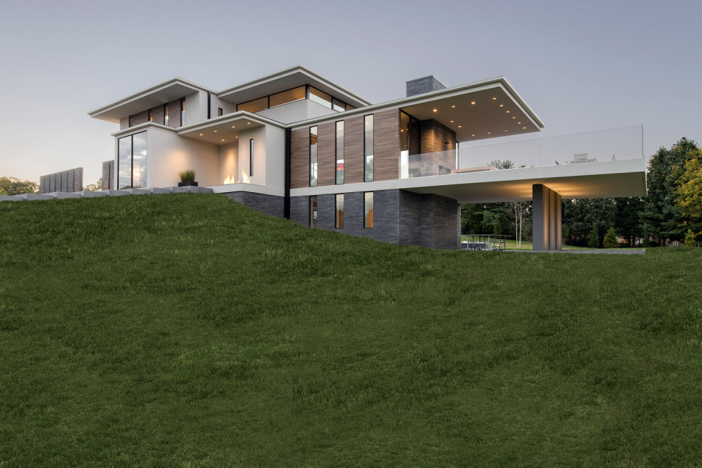 Diseño de fachada de casa multicolor contemporánea extra grande de tres plantas con revestimientos combinados y tejado plano