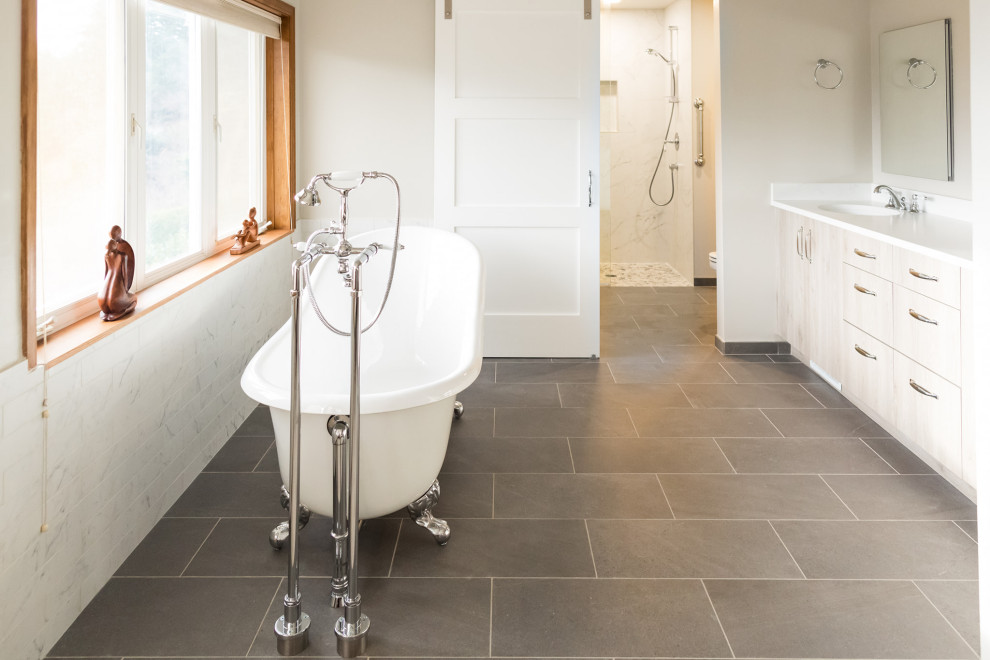 This is an example of a large transitional master bathroom in Seattle with flat-panel cabinets, brown cabinets, a claw-foot tub, a curbless shower, beige tile, beige walls, porcelain floors, an undermount sink, engineered quartz benchtops, grey floor, an open shower, white benchtops, a double vanity and a built-in vanity.