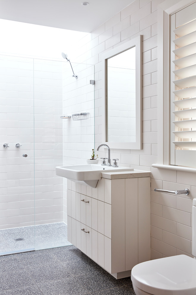 Beach style master bathroom in Sydney with white tile.