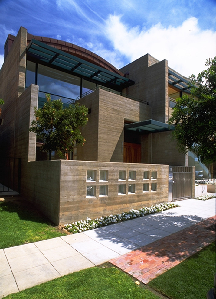 This is an example of a large modern two-storey brown house exterior in San Diego with wood siding and a flat roof.