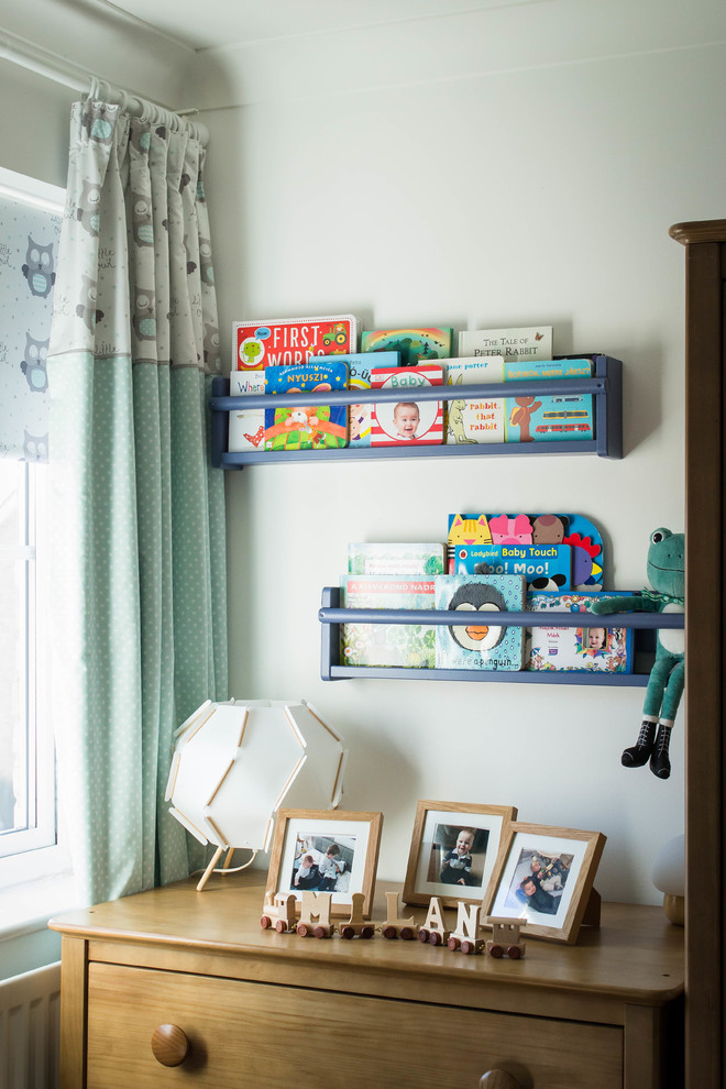 Inspiration for a small scandinavian gender-neutral kids' room in Berkshire with white walls, carpet and brown floor.