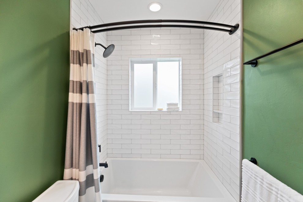 This is an example of a small bathroom in Other with white cabinets, an alcove tub, a shower/bathtub combo, a bidet, white tile, ceramic tile, green walls, slate floors, an undermount sink, engineered quartz benchtops, grey floor, a shower curtain, white benchtops, a single vanity and a built-in vanity.