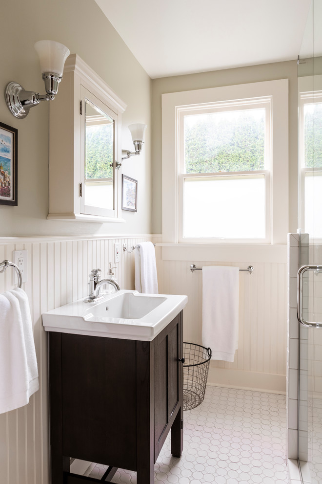 Inspiration for a small transitional bathroom in Portland with beige walls and dark hardwood floors.