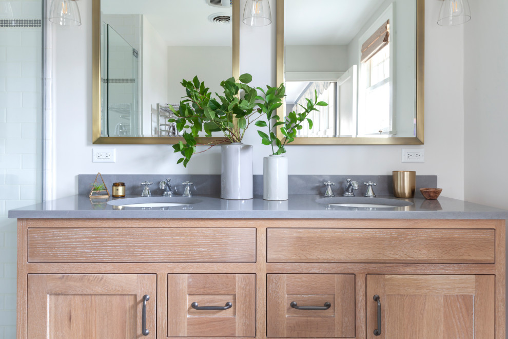 Mid-sized transitional master white tile ceramic tile, white floor and double-sink alcove shower photo in Chicago with shaker cabinets, light wood cabinets, a two-piece toilet, gray walls, a drop-in sink, quartz countertops, a hinged shower door, gray countertops and a freestanding vanity