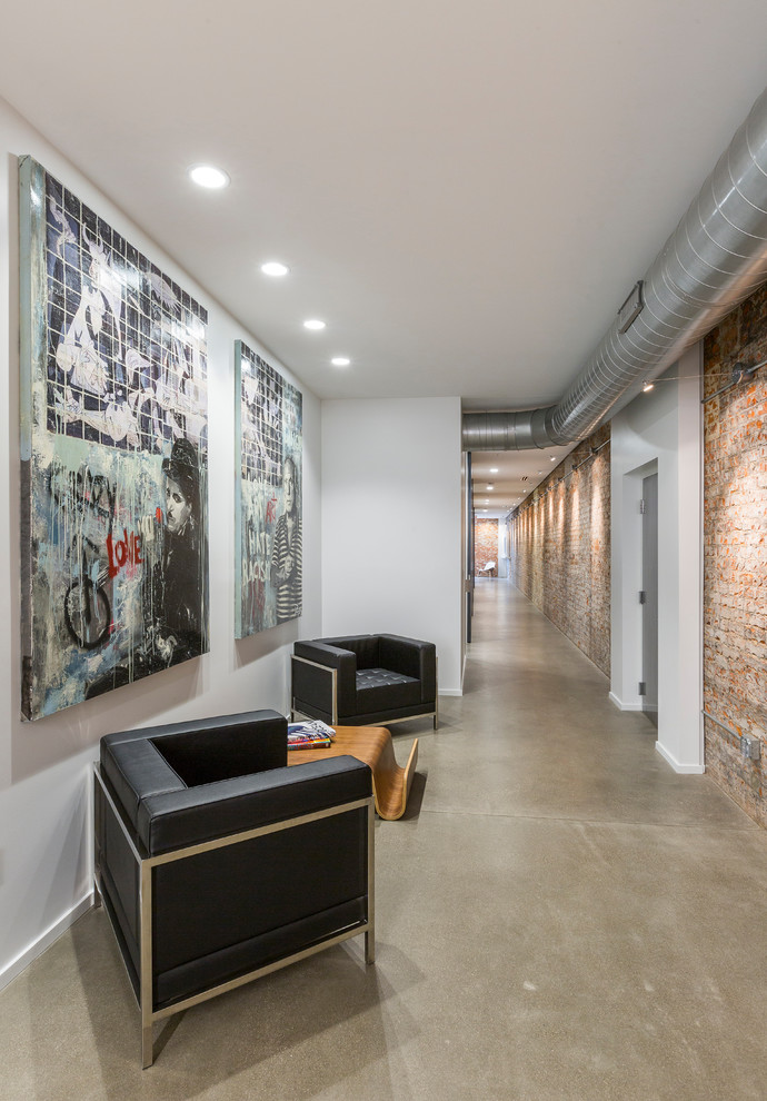 Photo of a large industrial foyer in Cincinnati with white walls, concrete floors and grey floor.