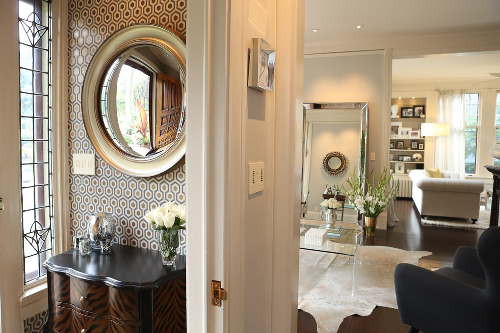 This is an example of a small contemporary foyer in Minneapolis with metallic walls, dark hardwood floors, a single front door and a white front door.