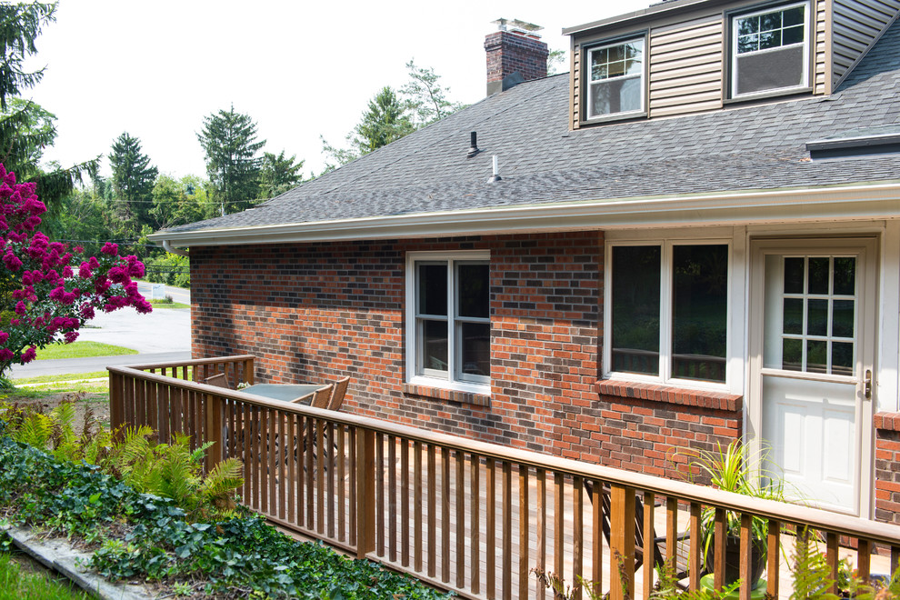 Inspiration for a small transitional backyard deck remodel with no cover