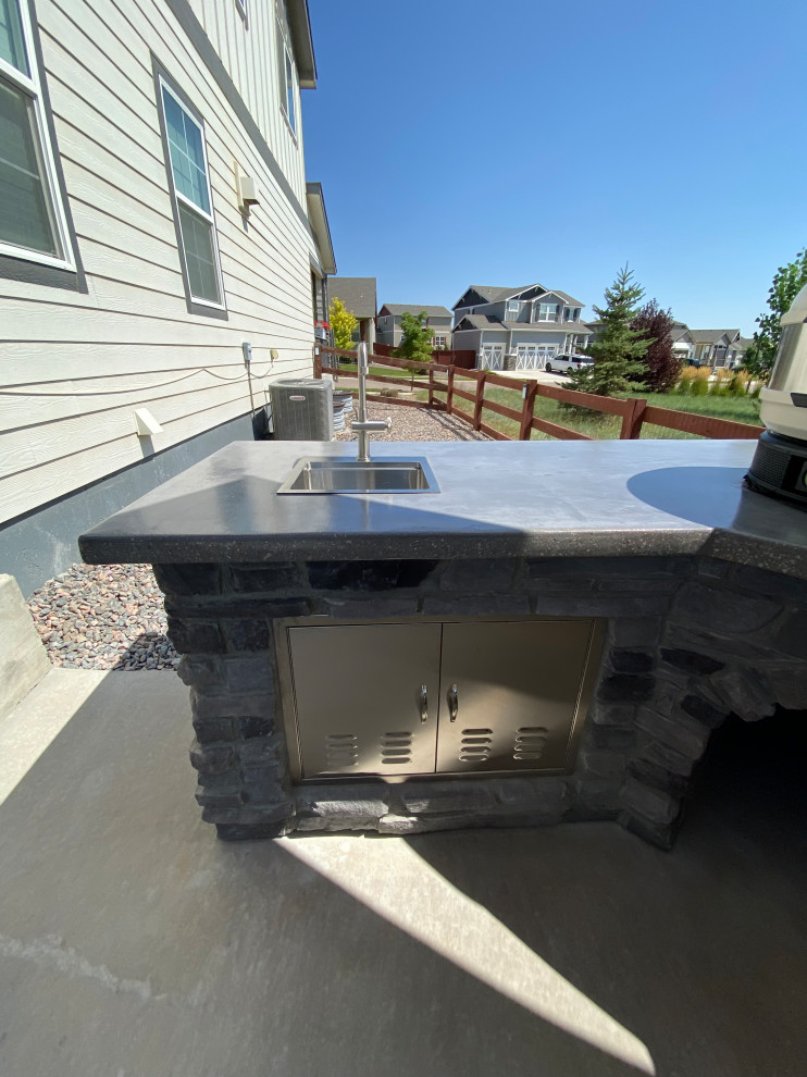 Rustic Reverie: Custom Concrete and Stone Unite in Your Outdoor Culinary Haven
