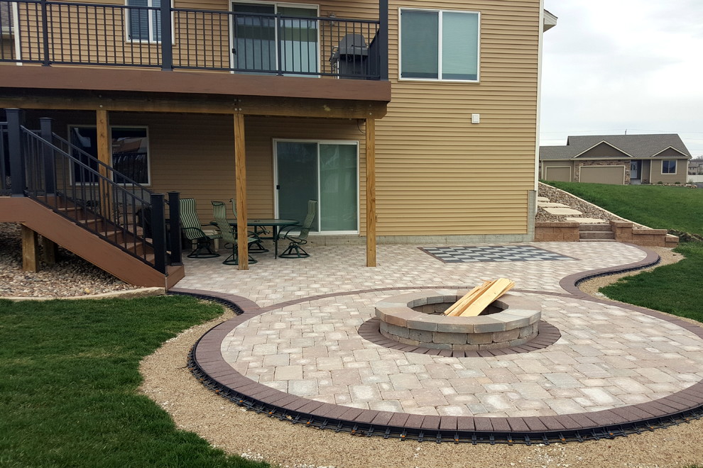 Example of a large backyard deck design with a pergola