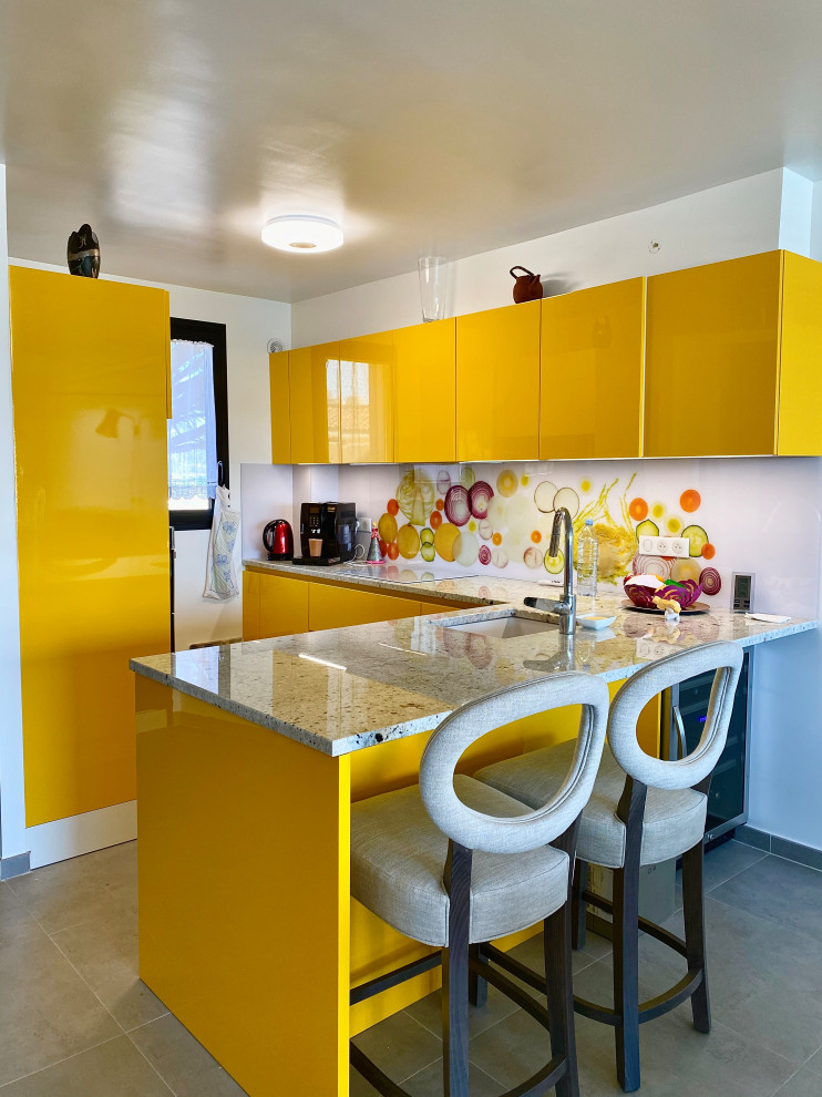 Photo of a mid-sized modern u-shaped open plan kitchen in Other with beaded inset cabinets, yellow cabinets, marble benchtops, no island and grey benchtop.